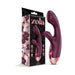 Zola rechargeable silicone dual massager in deep purple with rose gold accents beside its floral and butterfly-themed packaging.