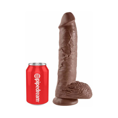 Brown realistic dildo with suction cup base next to a red soda can for size comparison.