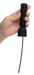 Hand holding a black silicone penis head teaser with flexible urethral sound and attached power cord.