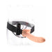 8-inch flesh-colored hollow strap-on with adjustable black harness and remote control on clear mannequin.