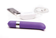 Purple Freestyle G Spot Vibrator with chrome accents and wireless transmitter connected to an MP3 player on white background