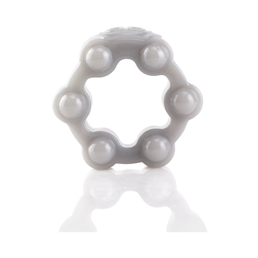 White flexible silicone erection ring with six rounded nodes and a reflective surface beneath.