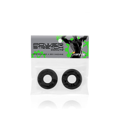 Two black Power Stretch Donuts in clear resealable packaging with branded label featuring a muscular figure and green gear graphics.