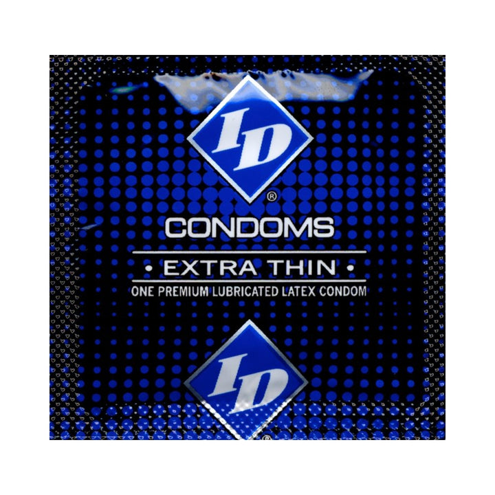 Close-up of ID Extra Thin premium lubricated latex condom in blue foil packaging with white text and logo.