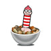Cartoon-style novelty figure wearing glasses and a red striped hat, standing in a bowl of mixed nuts.