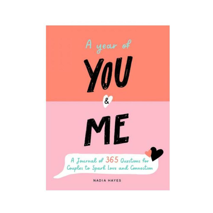 Cover of "A Year of You & Me" couples journal with coral and pink background and playful text design.