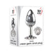 Small polished aluminum anal plug with clear jeweled base in retail packaging by Adam & Eve.