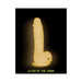 Glow in the dark silicone dildo with suction base and textured surface for versatile use.