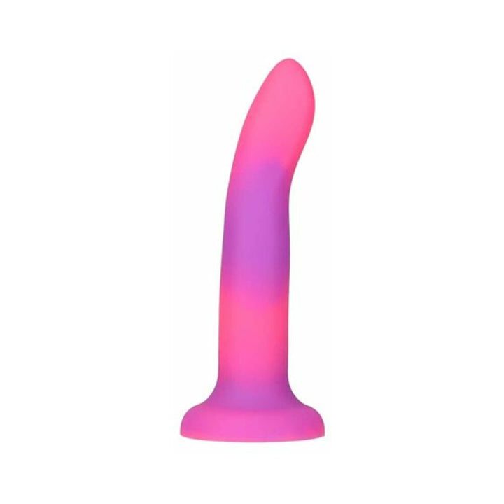 Pink and purple glow-in-the-dark silicone dong with a curved tip and suction base.
