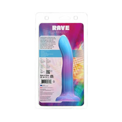 Purple and blue glow-in-the-dark silicone dong with suction base in clear retail packaging from Addiction Rave collection