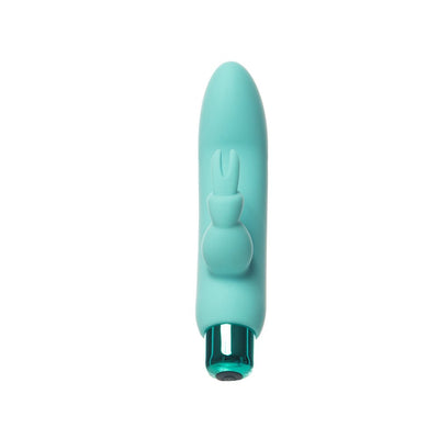 Compact turquoise bullet vibrator with removable silicone rabbit sleeve and metallic base, designed for dual stimulation.