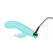 Compact blue silicone vibrator with removable rabbit sleeve and USB charging cable attached on white background.