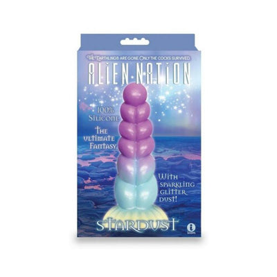 Packaging of Alien Nation Stardust silicone dildo with a shimmering purple to blue gradient and sparkling glitter dust design.