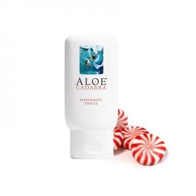 Aloe Cadabra 2.5oz peppermint personal moisturizer tube with peppermint candies on white background.