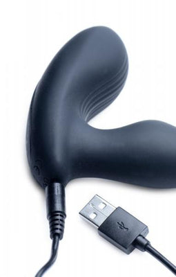 Black silicone prostate stimulator with USB charging cable on a white background.