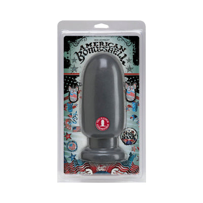 American Bombshell Shellshock Small gray plug in patriotic-themed clear packaging with flat base and rounded tip.