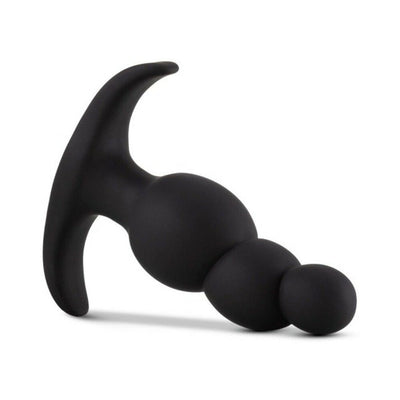Black silicone anal plug with three graduated tapered beads and a curved anchor base for secure placement.