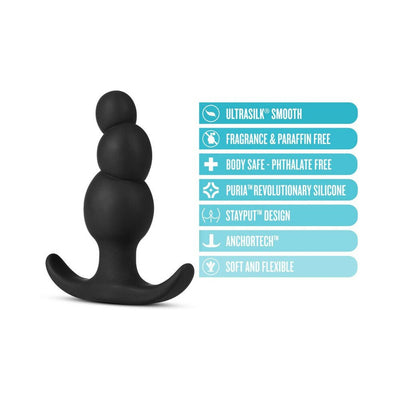 Black silicone anal plug with three tapered beads and curved base, highlighting body-safe, flexible, and fragrance-free features.