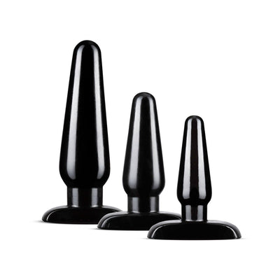 Set of three black tapered anal plugs in graduated sizes with flared bases for safe and comfortable use.