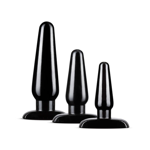 Set of three black tapered anal plugs in graduated sizes with flared bases for safe and comfortable use.