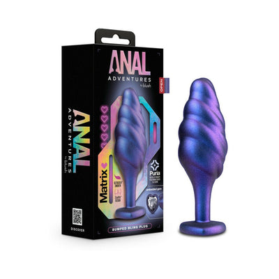 Purple and blue swirled textured anal plug with heart-shaped base and jewel, next to its black Anal Adventures packaging.