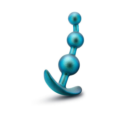 Teal anal plug with three graduated beads and curved base for secure, comfortable wear, made from smooth silicone.