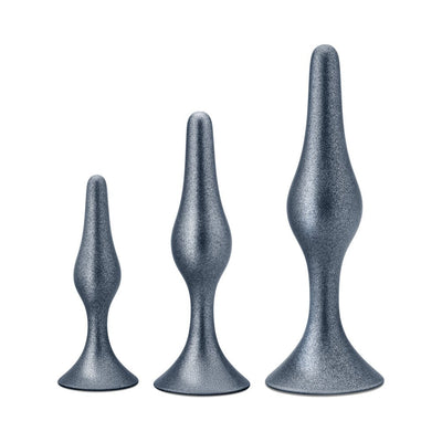 Set of three silver tapered anal plugs in small, medium, and large sizes with flared bases for secure fit.