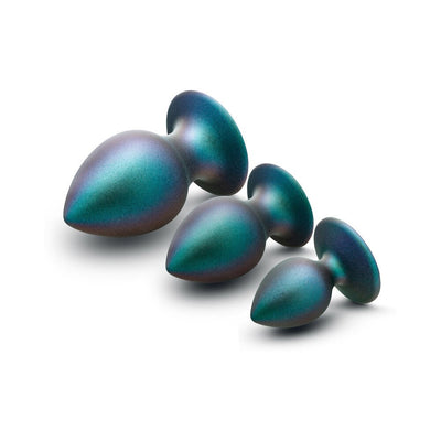 Set of three iridescent anal plugs in small, medium, and large sizes with tapered tips and flared bases.