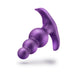 Purple anal plug with graduated beads and a curved, flared base for secure and comfortable wear.