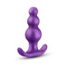 Purple anal plug with graduated bead design and curved flared base for secure, comfortable wear.