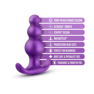 Purple anal plug with progressing bead sizes and flared base, highlighting body-safe silicone and beginner-friendly design features.