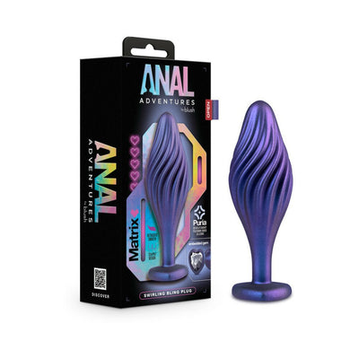 Purple swirl textured anal plug with heart-shaped base and embedded jewel, displayed next to its black packaging box.