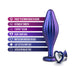 Purple wavy silicone anal plug with heart-shaped base and clear gem, highlighting body-safe and smooth design features.