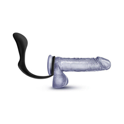 Black silicone cock ring plug designed for prostate stimulation shown on a translucent model.
