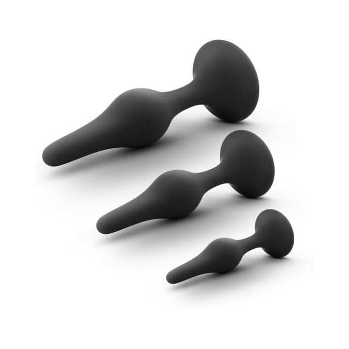 Set of three black silicone beginner anal plugs in small, medium, and large sizes with tapered shapes and flared bases.
