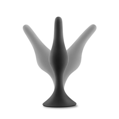 Black silicone beginner anal plug with tapered tip and flared base shown with motion effect on white background