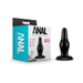 Black tapered anal plug with wide neck and flared base next to its blue and white Anal Adventures packaging.