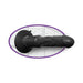 Black vibrating anal toy with realistic texture and suction base mounted on a tiled wall background.
