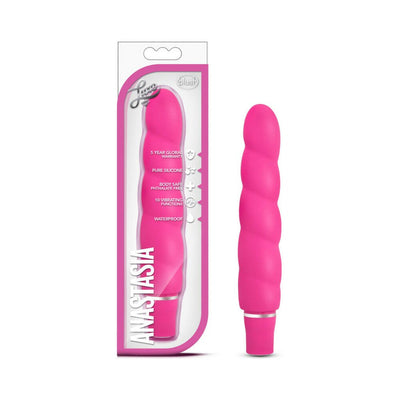 Pink silicone vibrator with spiral design next to its clear and pink packaging labeled Anastasia by Blush Luxe.