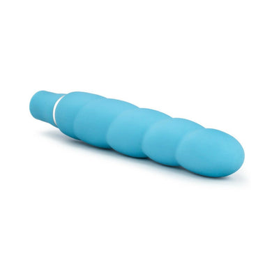 Blue silicone vibrator with a smooth spiral design and rounded tip, featuring a white accent near the base.