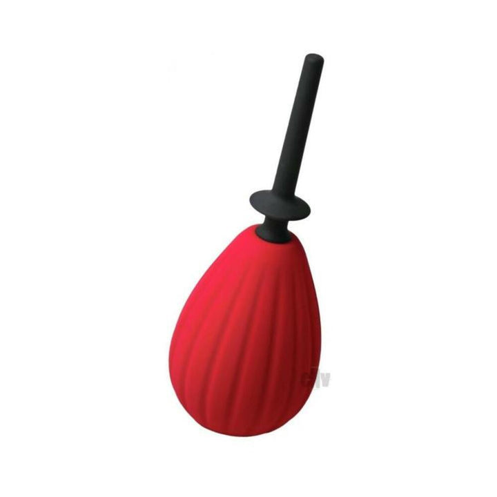 Red silicone enema bulb with black slow flow nozzle and backstop for controlled internal cleansing.