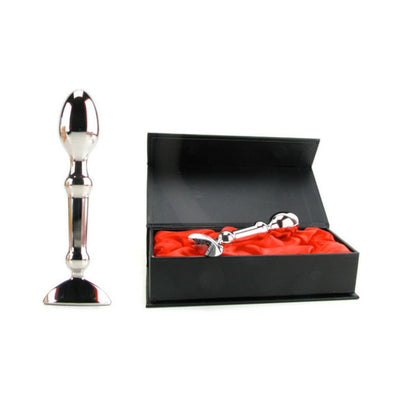 Stainless steel Aneros Tempo massager displayed standing and inside an open black gift box with red satin lining.
