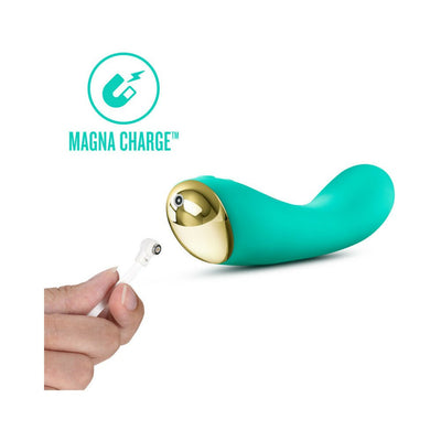 Teal curved vibrator with gold accent shown with magnetic USB charging cable and Magna Charge logo.