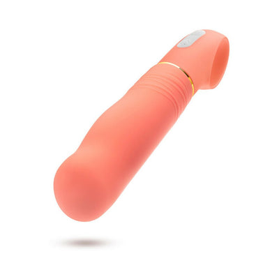 Coral-colored curved vibrator with textured grip and loop handle, made from smooth silicone with control buttons on handle.