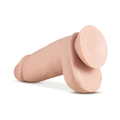Realistic vanilla-colored adult toy with suction cup base and lifelike texture on white background