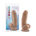 7-inch realistic brown dildo with suction cup base shown in packaging and standing upright beside it.