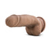 Realistic 7-inch brown TPE dildo with suction cup base and lifelike texture, flexible and posable for versatile use.