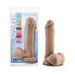 8 inch Au Naturel Sensa Feel dual density dildo with flexible spine and suction cup base in natural skin tone next to packaging.