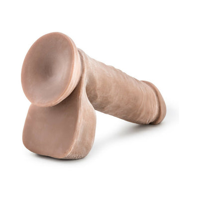 Realistic 8-inch dual density dildo with flexible base in natural skin tone on white background.