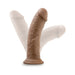 Flexible realistic dildo in vanilla color with suction cup base shown in multiple angled positions
